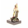 Bronze sculpture of a cardinal bird sitting on a branch