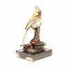 Bronze sculpture of a cardinal bird sitting on a branch