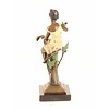 Bronze sculpture of a female with a bird on her arm