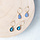 Minimalistic earrings with drop charm