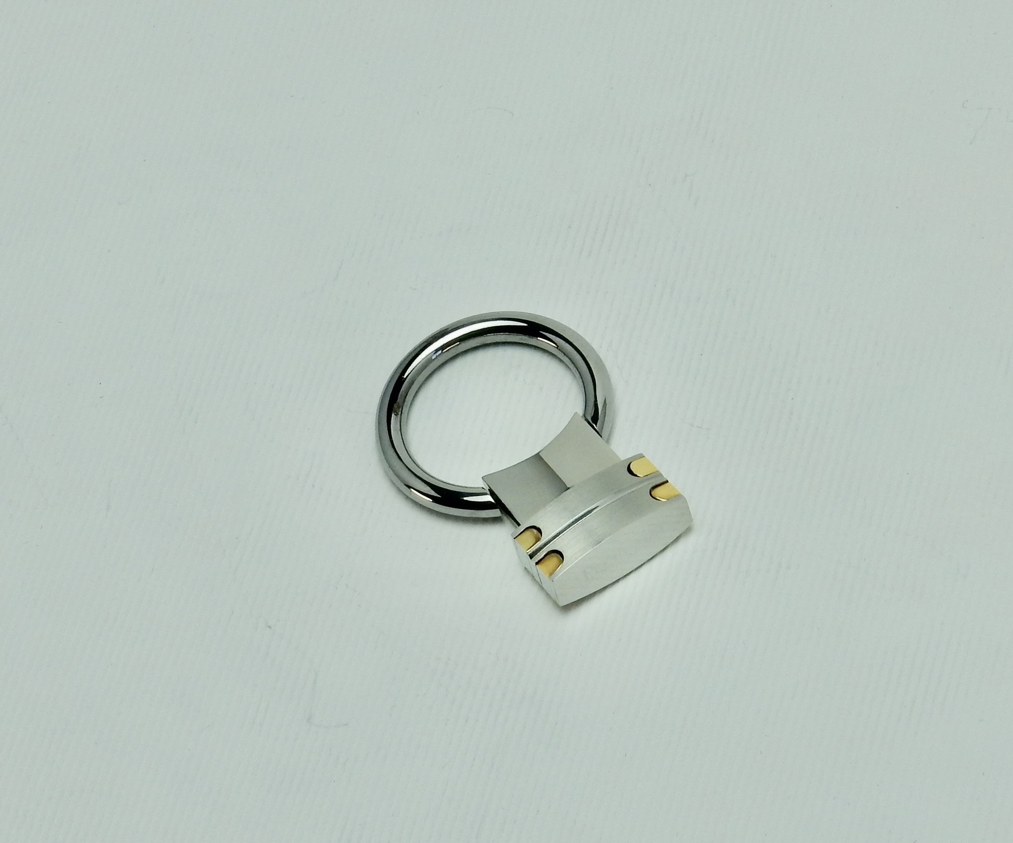 Péquignet sleutelhouder in staal en 18 krt. geelgoud, 45 mm lang