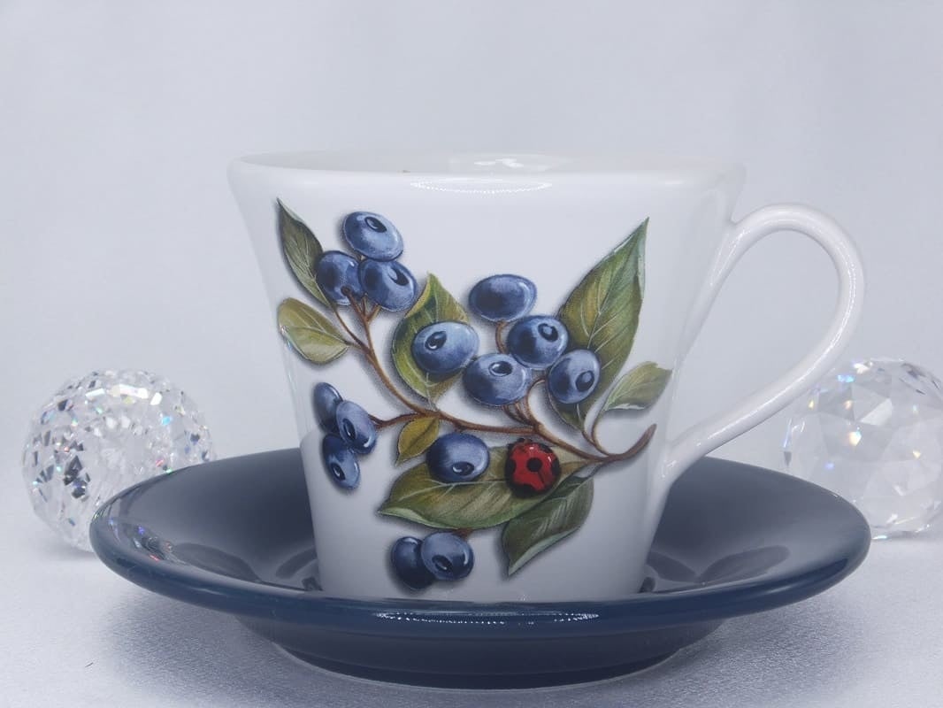 Coffee cup with saucer with pattern