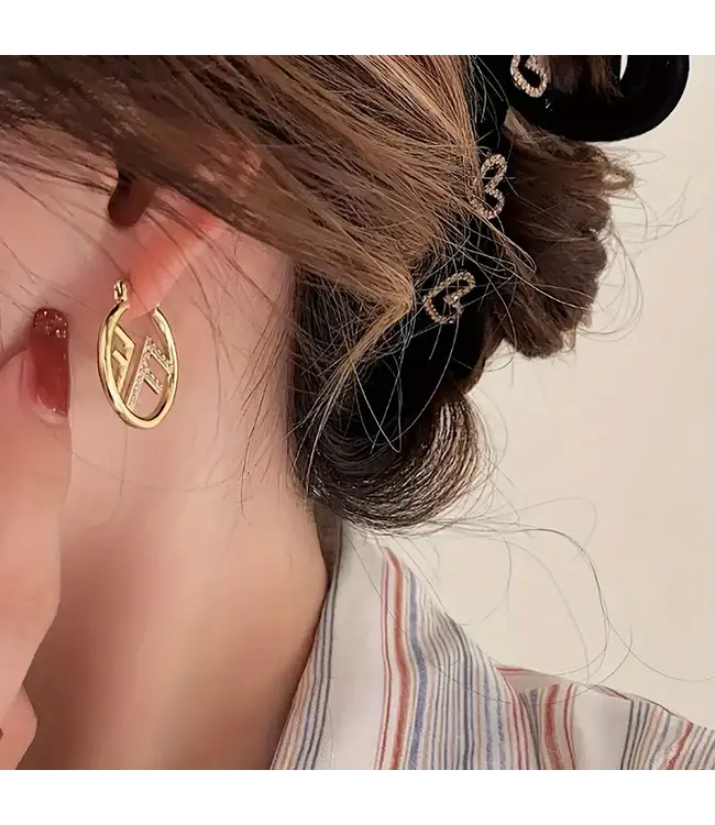 Vintage gouden oorbellen FF met steentjes