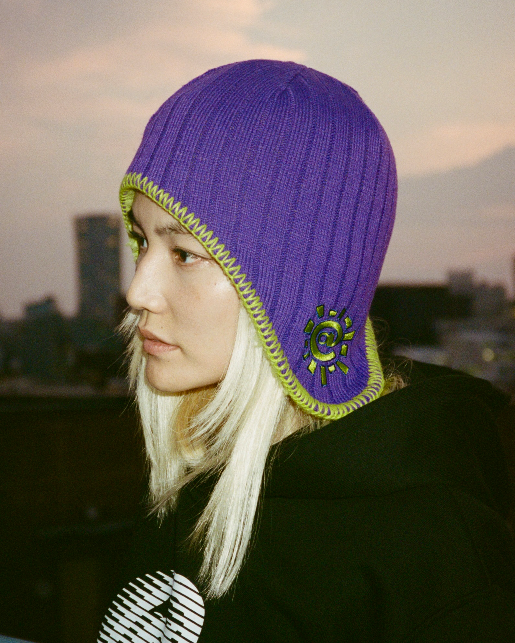 Always reversible ear flap (purple/green)