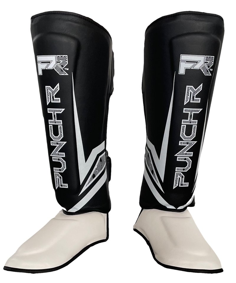 PunchR™  PunchR™ Electric Kickboxing Muay Thai Schienbeinschützer Schwarz-weiße Mikrofaser