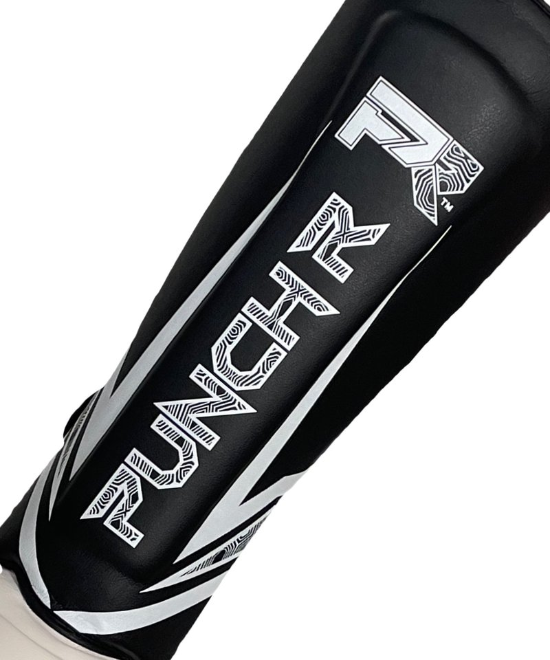 PunchR™  PunchR™ Electric Kickboxing Muay Thai Schienbeinschützer Schwarz-weiße Mikrofaser