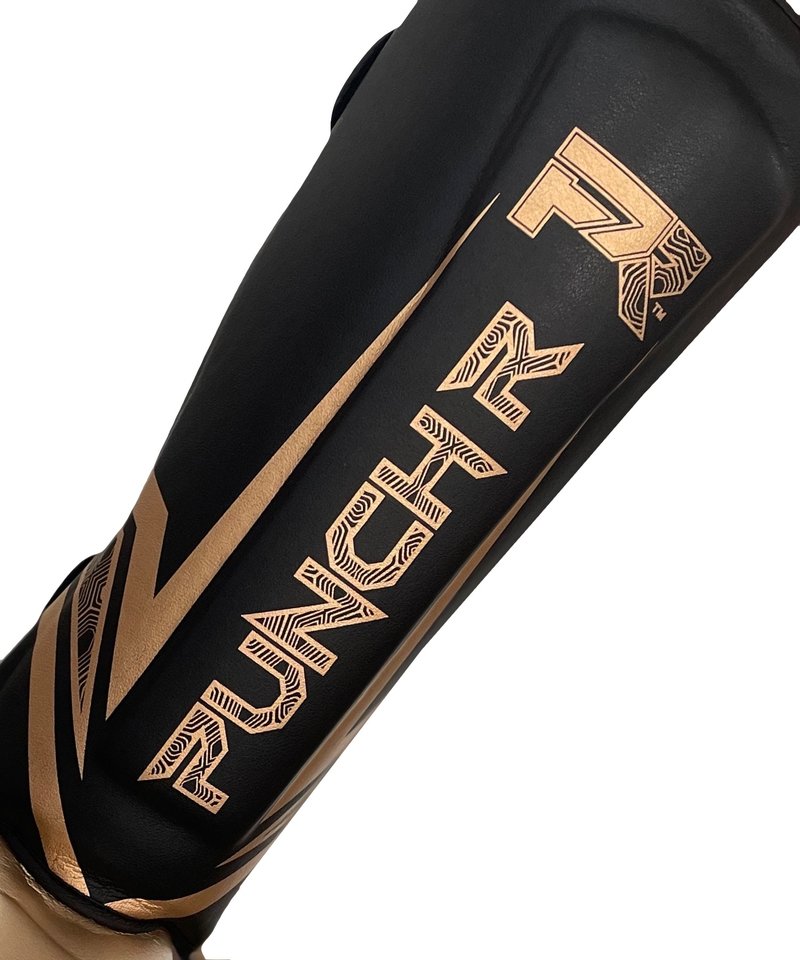 PunchR™  PunchR™ Electric Kickboxen Schienbeinschützer Schwarz Gold Mikrofaser