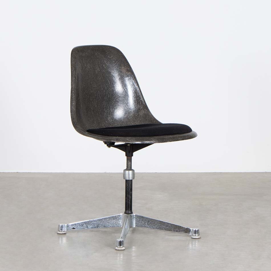 Eames brown fiberglass chair with upholstered seat and height-adjustable swivel leg