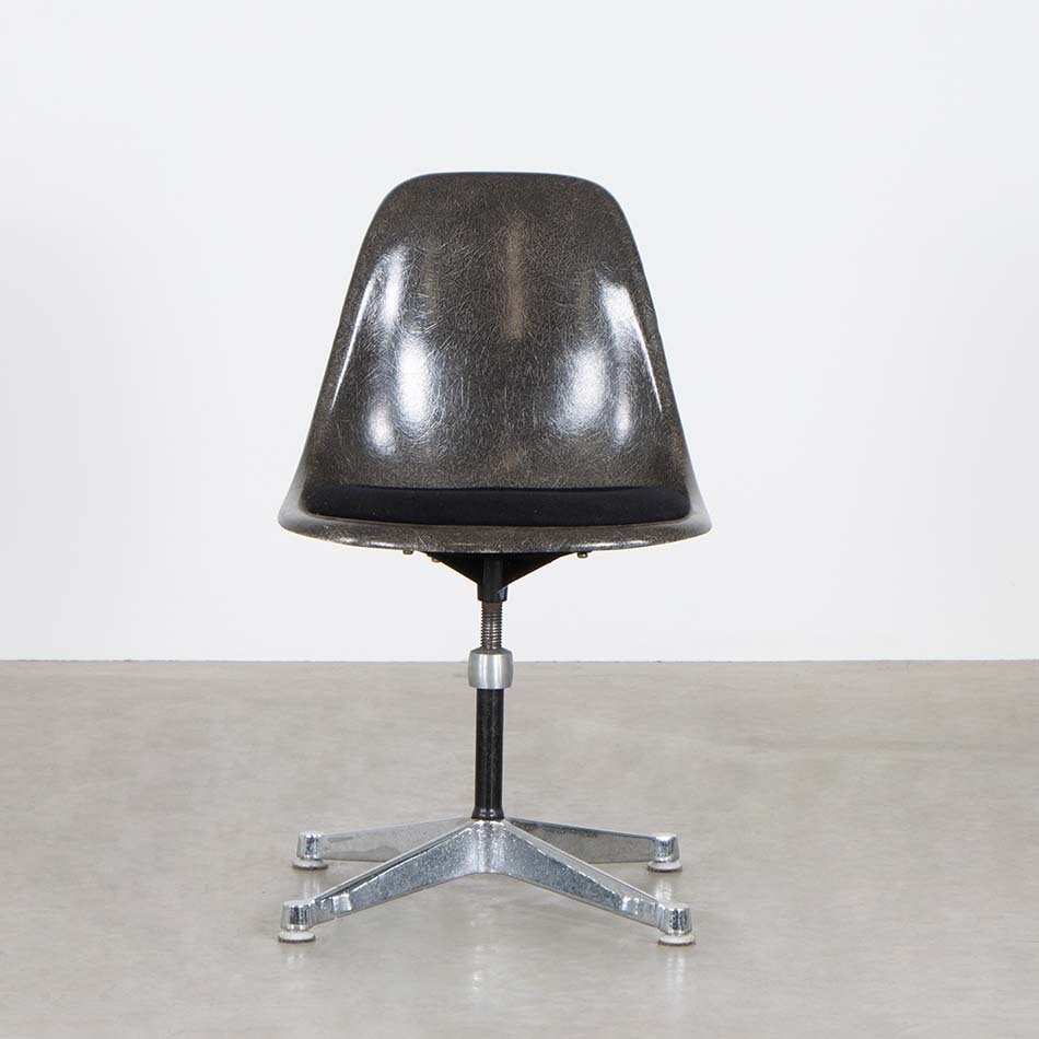 Eames brown fiberglass chair with upholstered seat and height-adjustable swivel leg