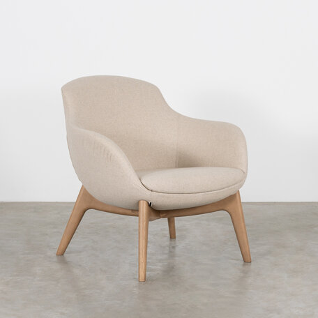 Matti armchair upholstered in wool and wooden legs