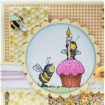 Carimbo de borracha, abelhas, uma vela e um muffin / queque