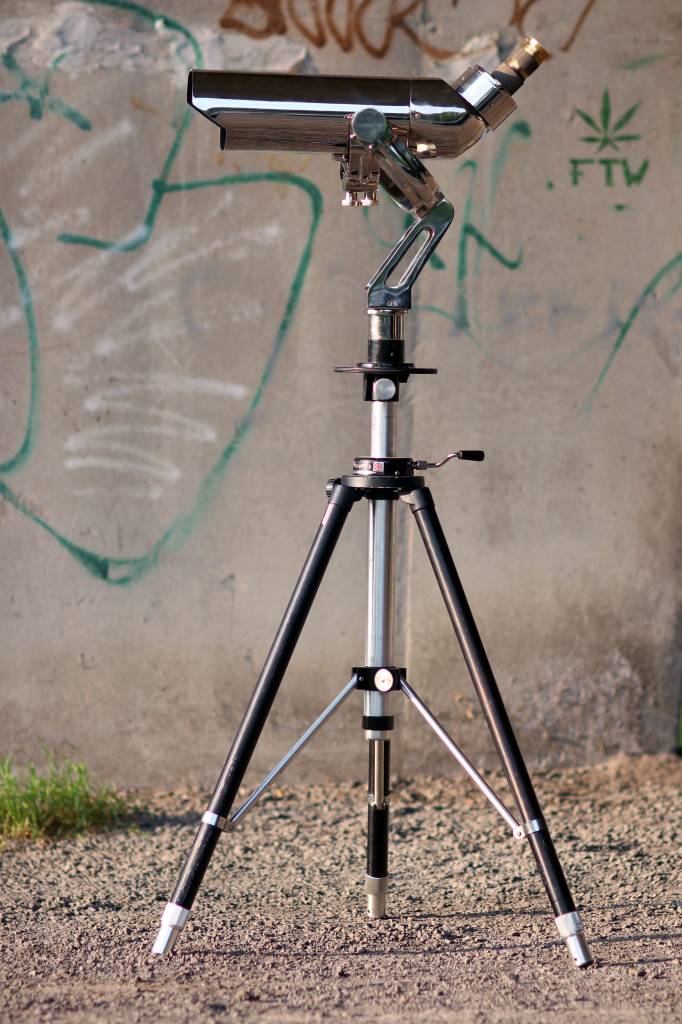 Large binoculars on aluminum tripod