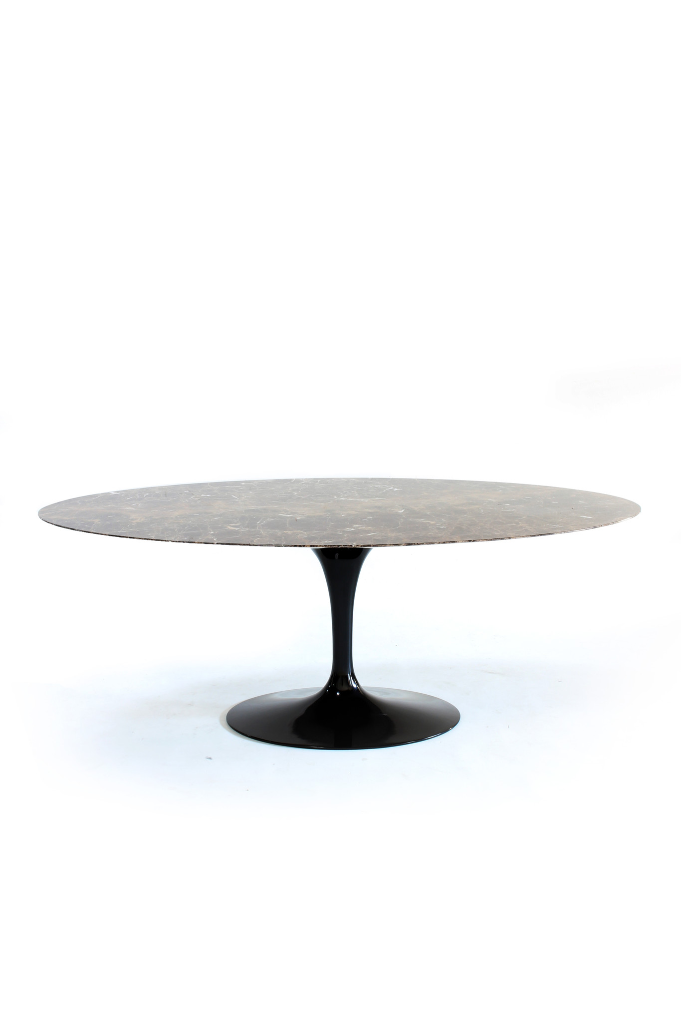 Eero Saarinen Knoll oval table with matching tulip chairs.