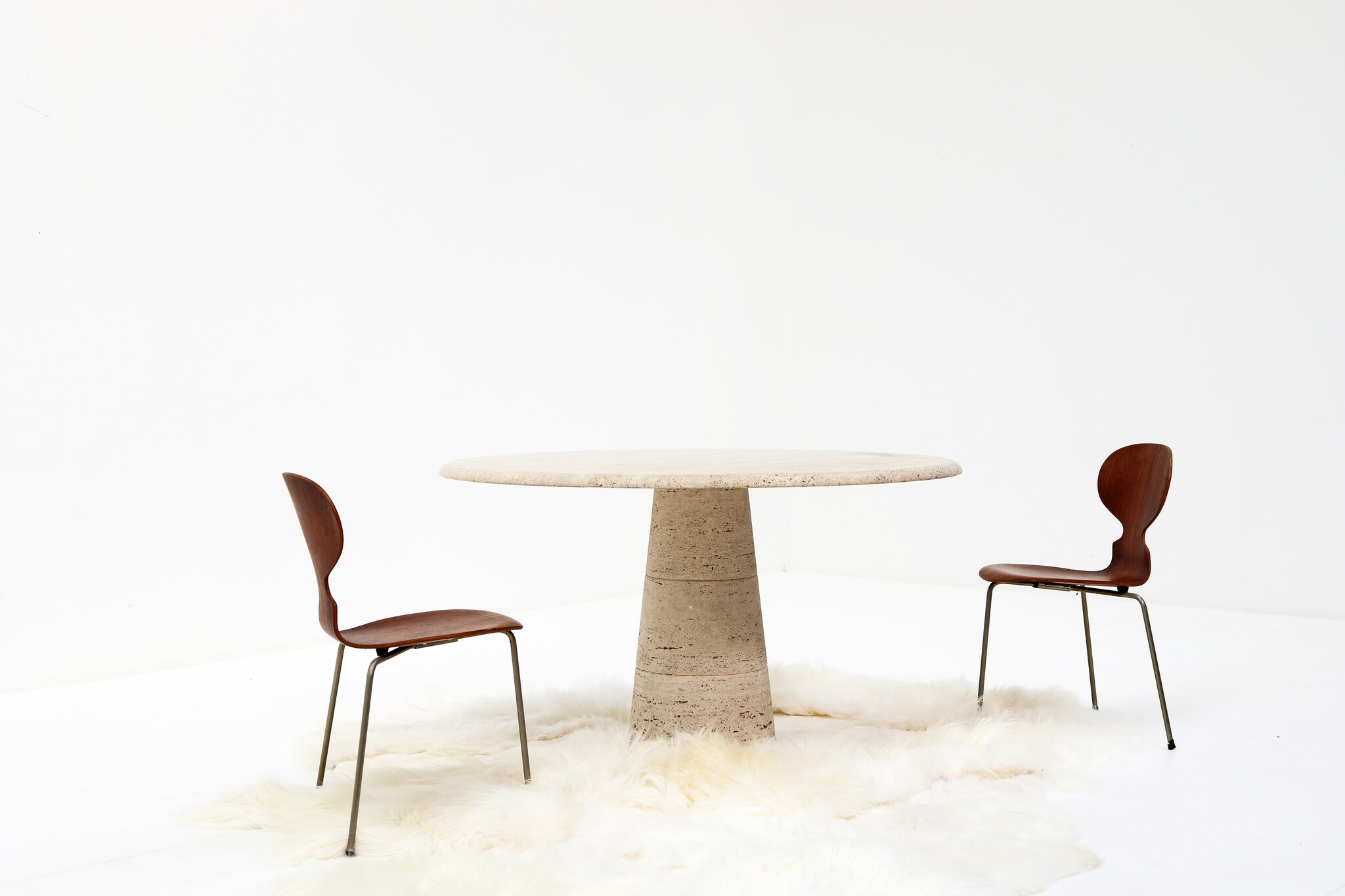 Round travertine dining table by UP & UP, 1970s