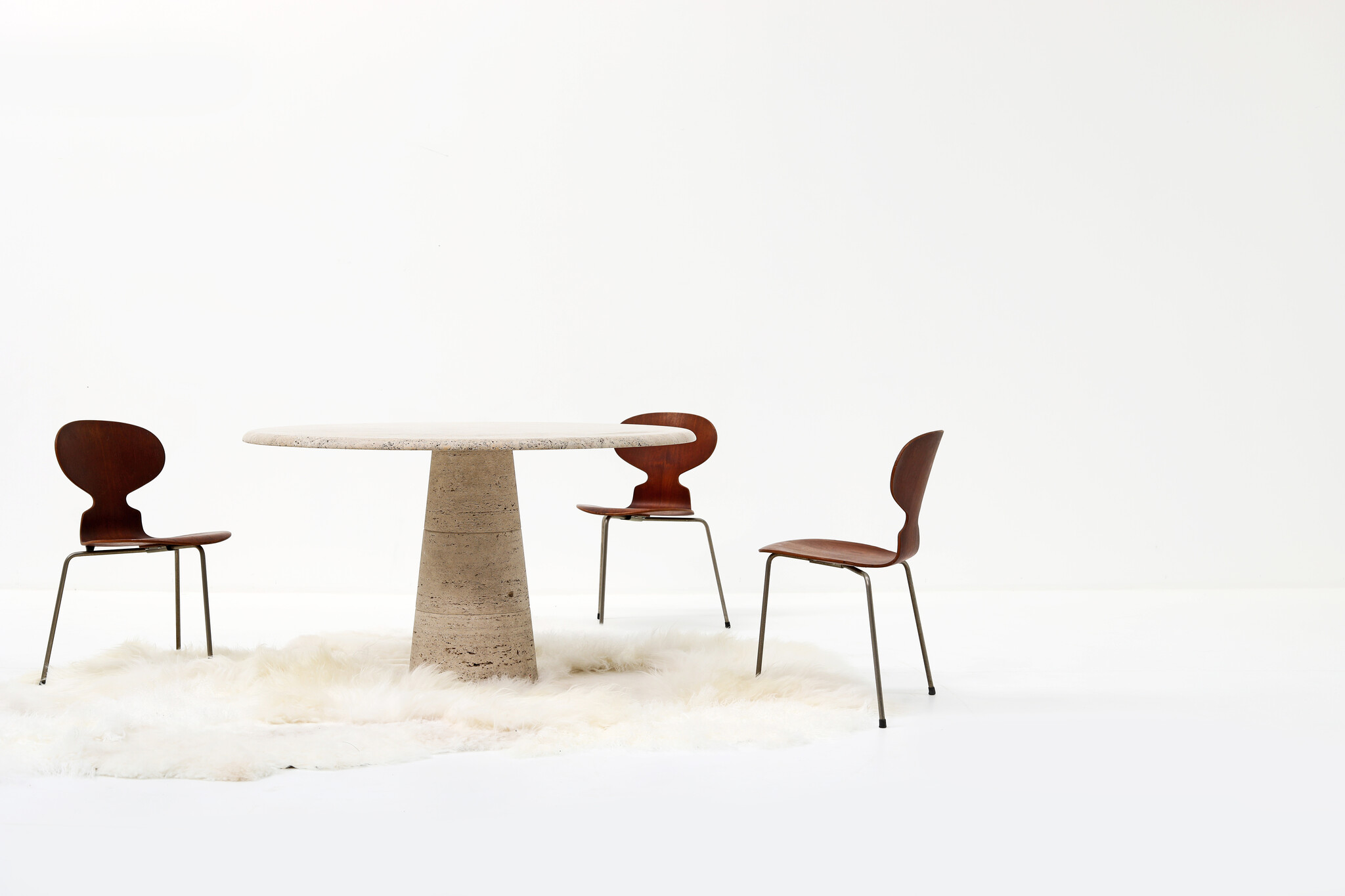 Round travertine dining table by UP & UP, 1970s