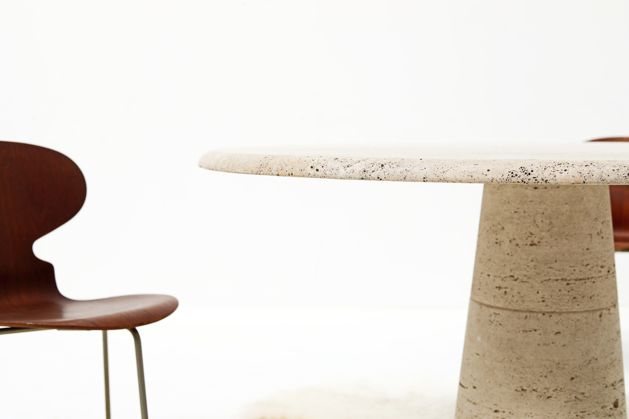 Round travertine dining table by UP & UP, 1970s
