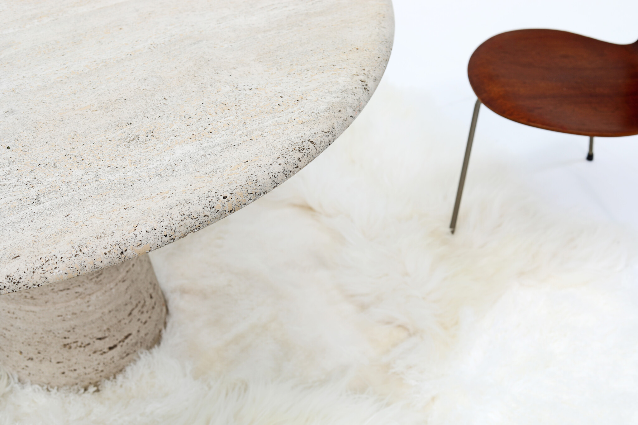 Round travertine dining table by UP & UP, 1970s