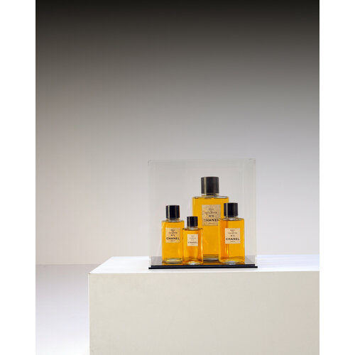 Chanel bottles in display case