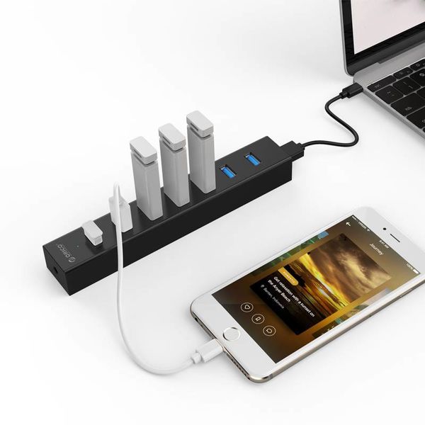 Orico USB 3.0 hub with 7 ports in matt black design with 1 meter 5Gbps USB 3.0 data cable and extra USB power cable