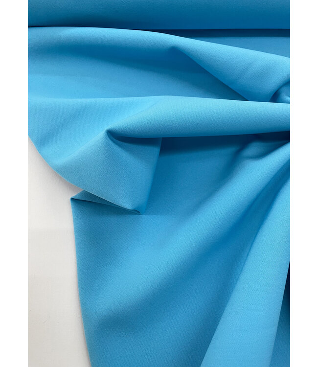 A la Ville aqua blauw - klassevolle doorvallende broekenstof