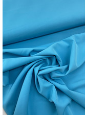 A la Ville aqua blauw - klassevolle doorvallende broekenstof