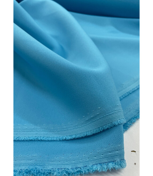 A la Ville aqua blauw - klassevolle doorvallende broekenstof