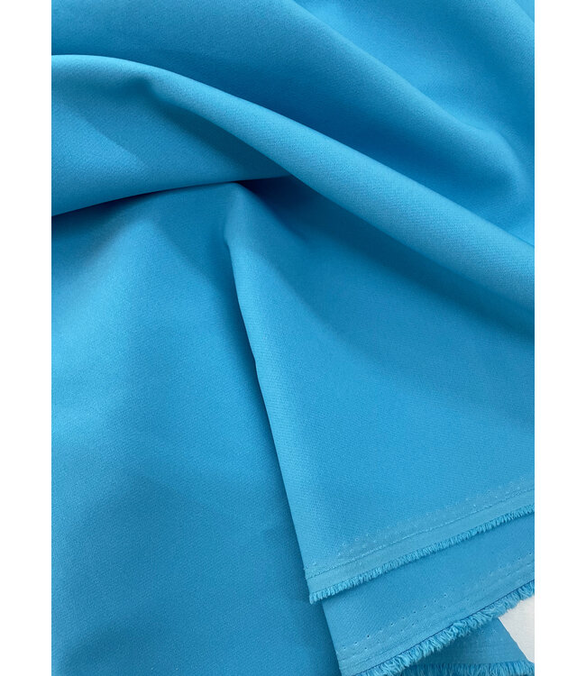 A la Ville aqua blauw - klassevolle doorvallende broekenstof