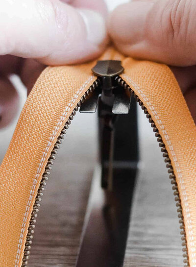SBM tool for threading zippers