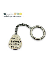 SBM "She believed..." keychain - nickel