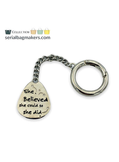 SBM "She believed..." keychain - nickel