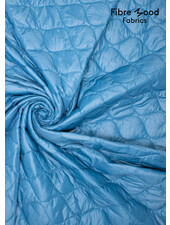 Fibremood lichtblauw druppel  gematelasseerde stof - Dunya - puffer stof