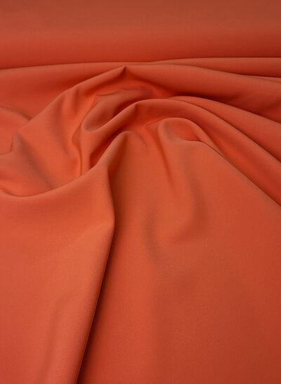 A la Ville zomers oranje - prachtig doorvallende stof voor kleedjes of broeken
