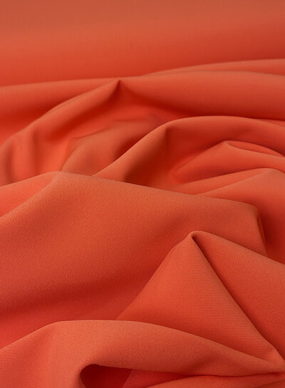 A la Ville zomers oranje - prachtig doorvallende stof voor kleedjes of broeken