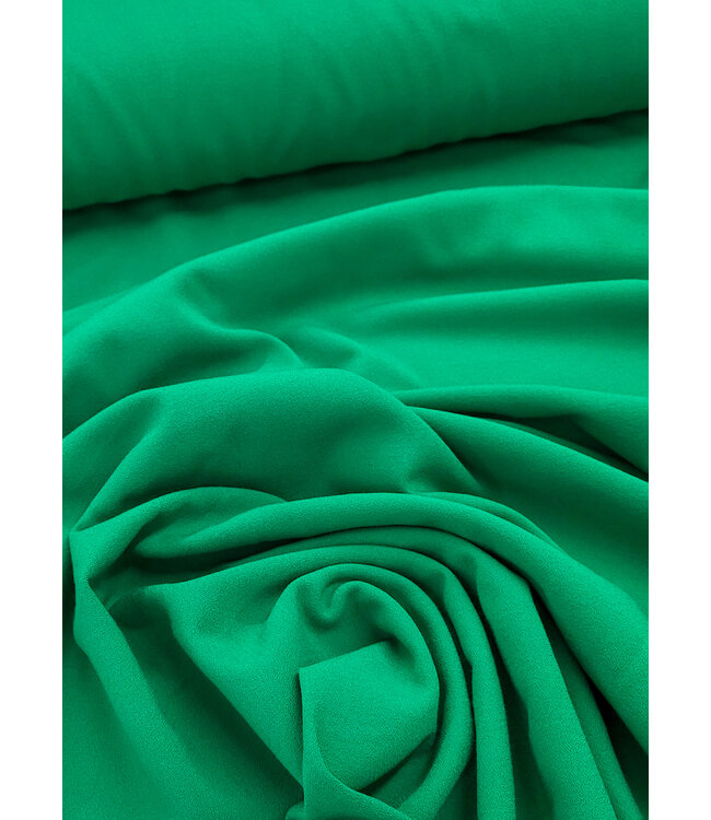 grasgroene crêpe - viscose mix met lichte stretch