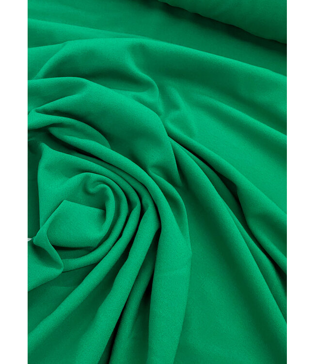 grasgroene crêpe - viscose mix met lichte stretch
