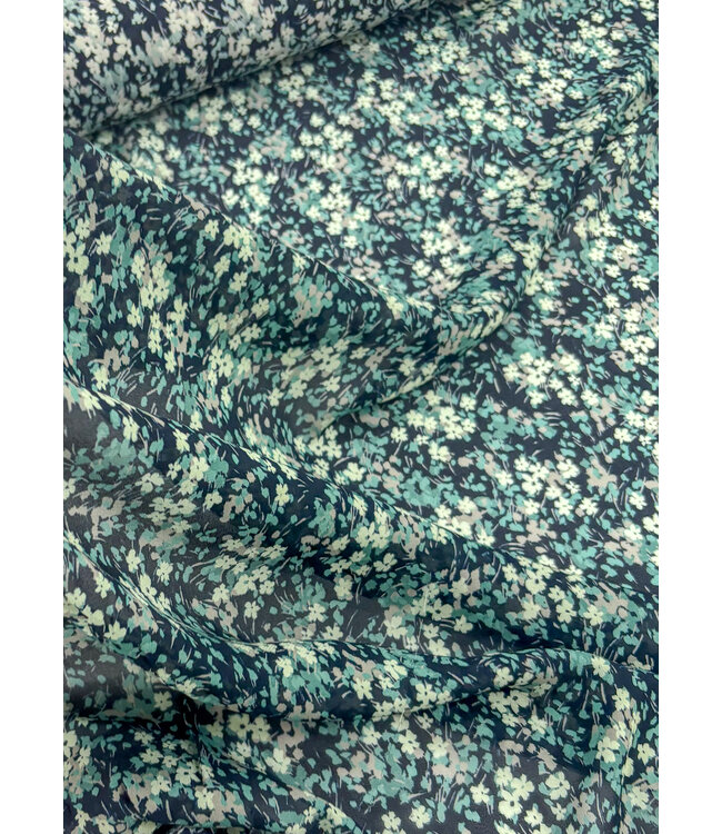 deadstock petrolkleurige bloemetjes op marineblauwe voile