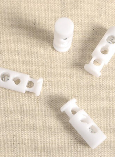 4 elongated cord stoppers - white