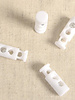 4 elongated cord stoppers - white