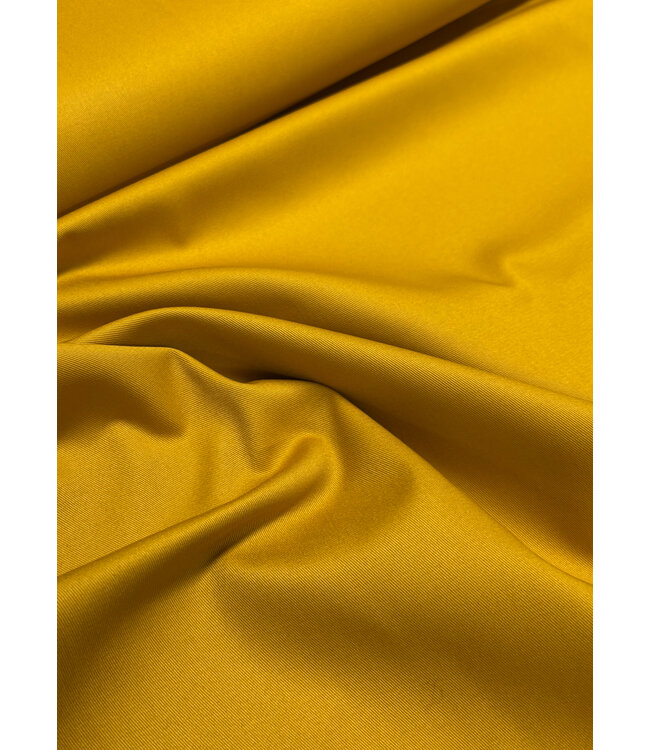 Madeline oker katoen gabardine - vast en stevig geweven - trenchcoat stof (niet waterproof)