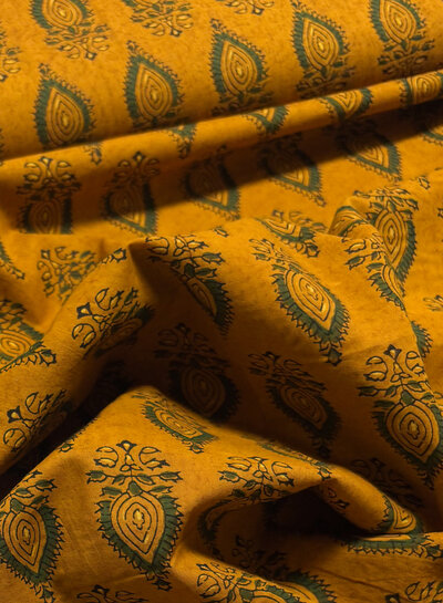 Madeline batik cotton voile - eye of india sun gold