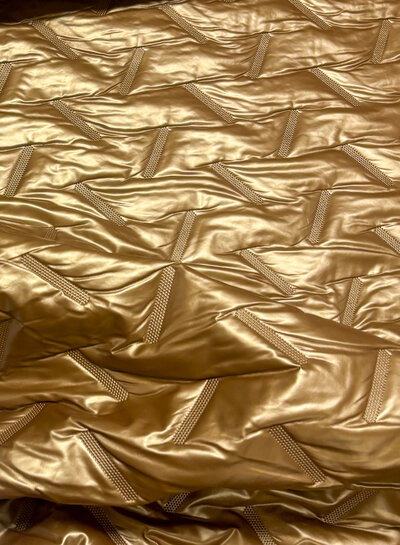 strikes- gold stepper - matelassed fabric puffer