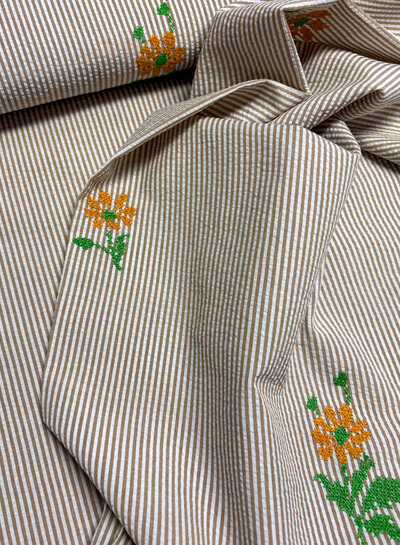 nude pink stripes with embroidered Aztec flower - seersucker