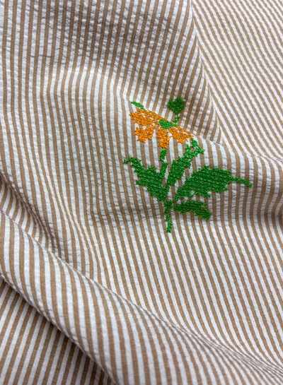 nude pink stripes with embroidered Aztec flower - seersucker