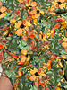salmon-colored flowers on green - viscose