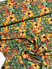 zalmkleurige bloemetjes op groen - viscose
