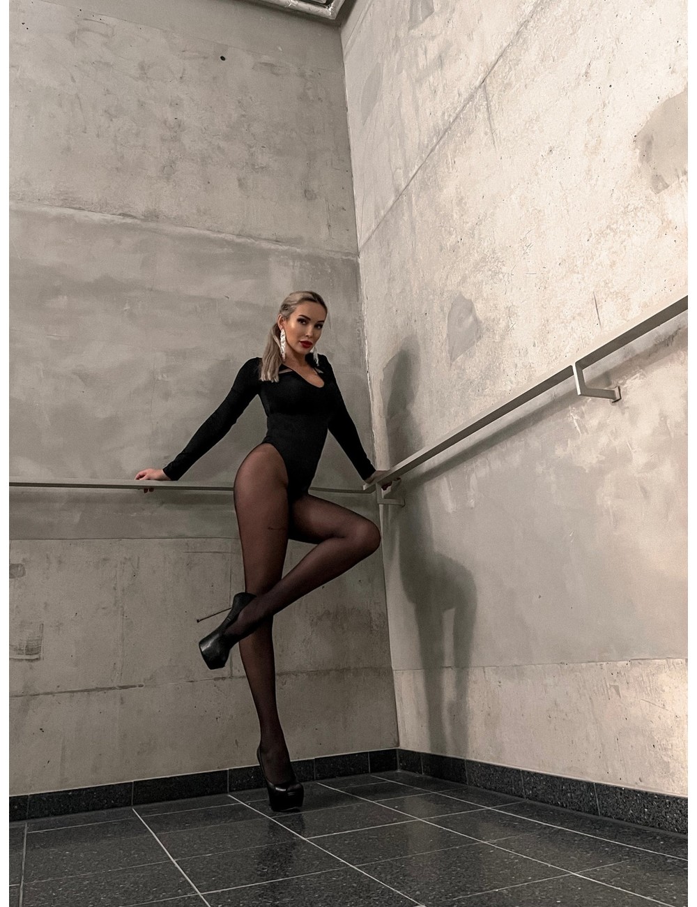 Woman in leotard and heels Stock Photo