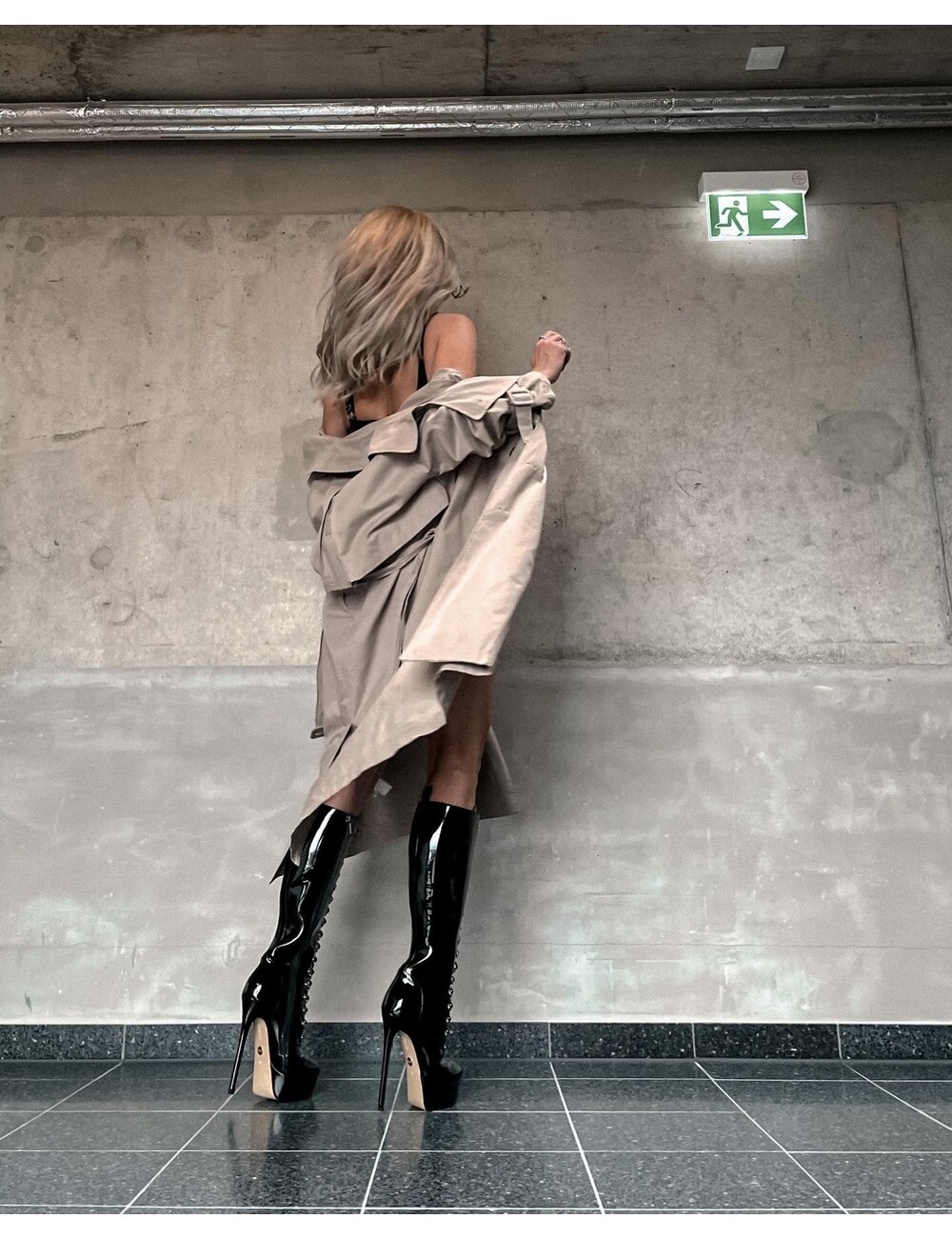 Sanctum Shoes Gabriela wearing our fetish lace-up knee boots in black shiny