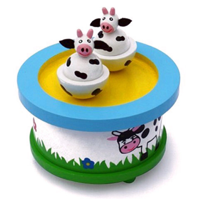 Speeldoos dansende Koeien in de wei