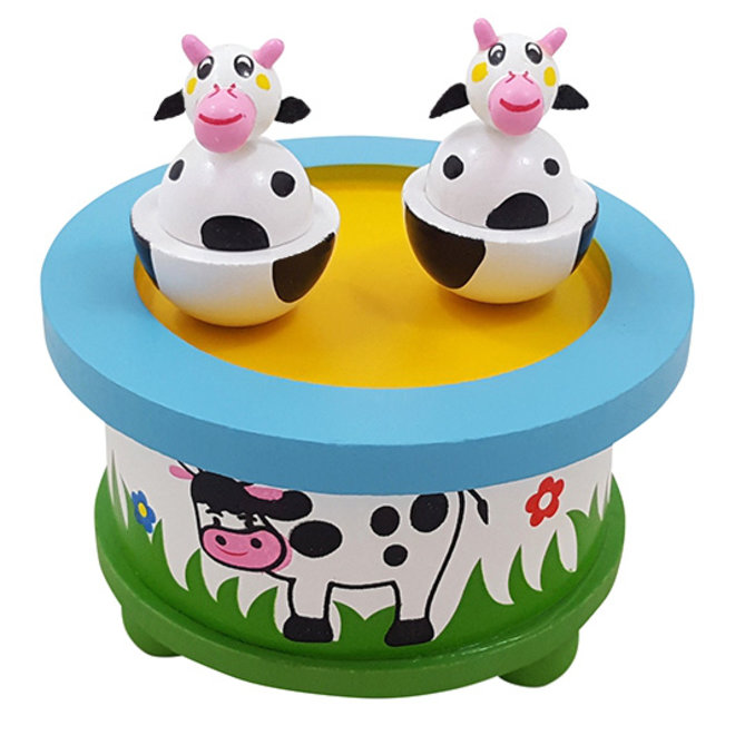 Speeldoos dansende Koeien in de wei