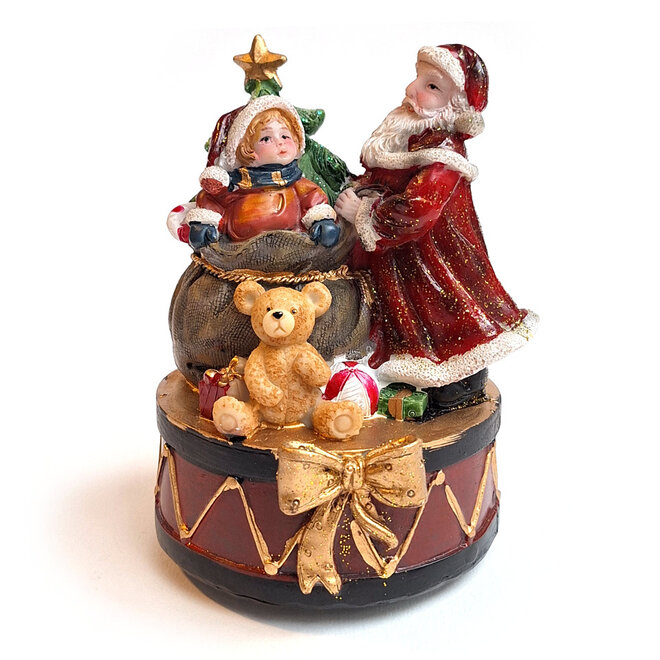 Kerstman met kind bij kadozak